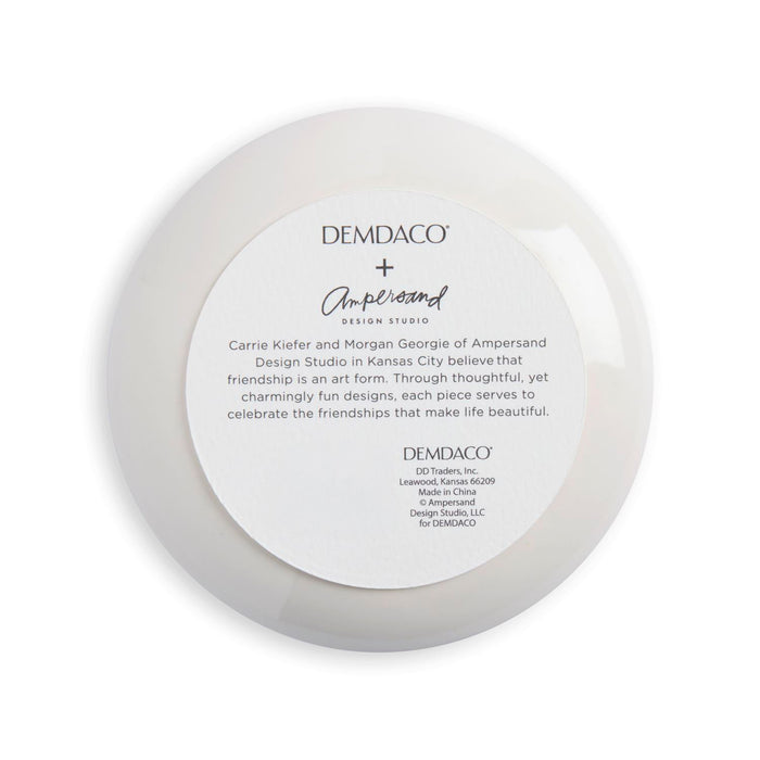 Round white dish with Demdaco and Ampersand branding on a white background