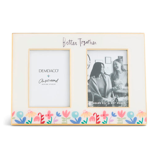 Decorative photo frame with floral design and text on a white background
