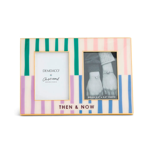 A rectangular picture frame with a pastel striped border in pink, green, purple, and blue, featuring two photo slots and the text 'THEN & NOW' at the bottom. The left insert shows the Demdaco + Angel Island Collection logo.