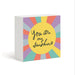 A square white block sign with a colorful sunburst design and the phrase 'You are my Sunshine' in black script, shown on a clean white background.