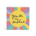 A square decorative block or plaque with a colorful sunburst design and the phrase 'You are my Sunshine' in black script on a yellow center circle, shown on a white background.