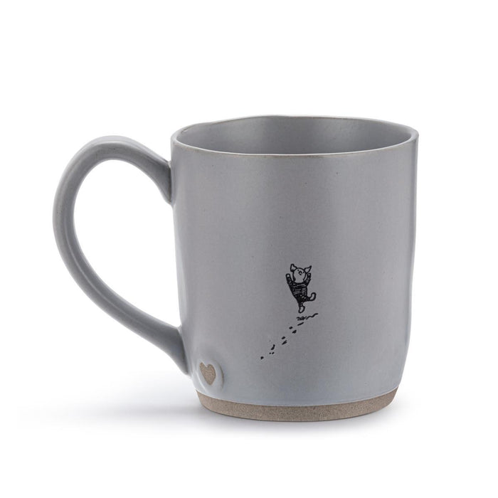 Gray mug with a black cat illustration and paw print on a white background