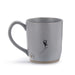 Gray mug with a black cat illustration and paw print on a white background