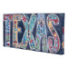 Decorative sign with colorful letters spelling 'TEXAS' on a white background