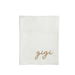 White towel with 'gigi' embroidery on a white background