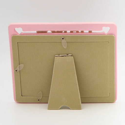 Pink and beige clipboard with stand on a white background