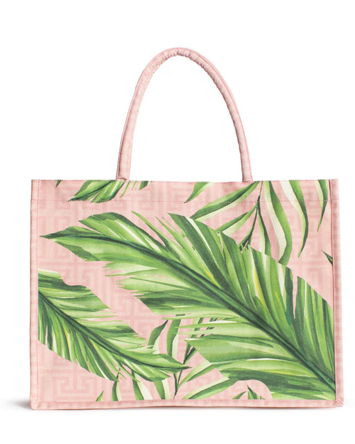 Tote bag with green leaf pattern on a pink background