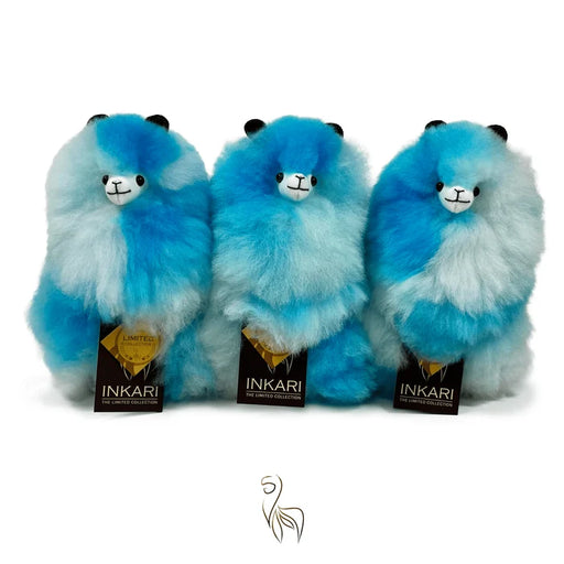 Three fluffy blue and white gradient plush toys with small gray eyes, shown from the back against a white background.