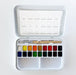 Watercolor paint set with color swatches and a brush on a white background