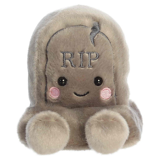 Plush toy resembling a cartoonish tombstone with 'RIP' on a white background
