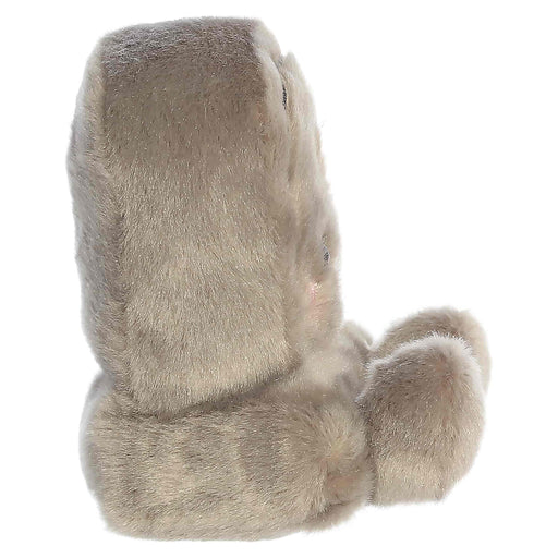 Plush toy resembling a tombstone with gray fur on a white background