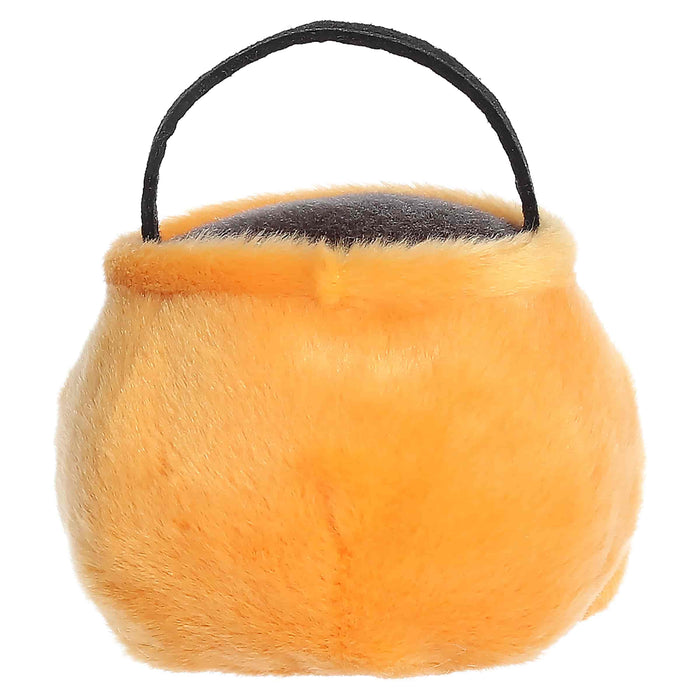 Furry orange toy with a black handle on a white background