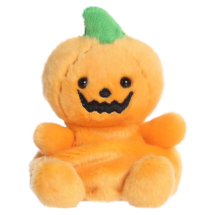 Plush toy pumpkin with a smiling face on a white background