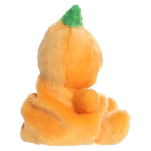 Plush toy shaped like a pumpkin with a green stem on a white background