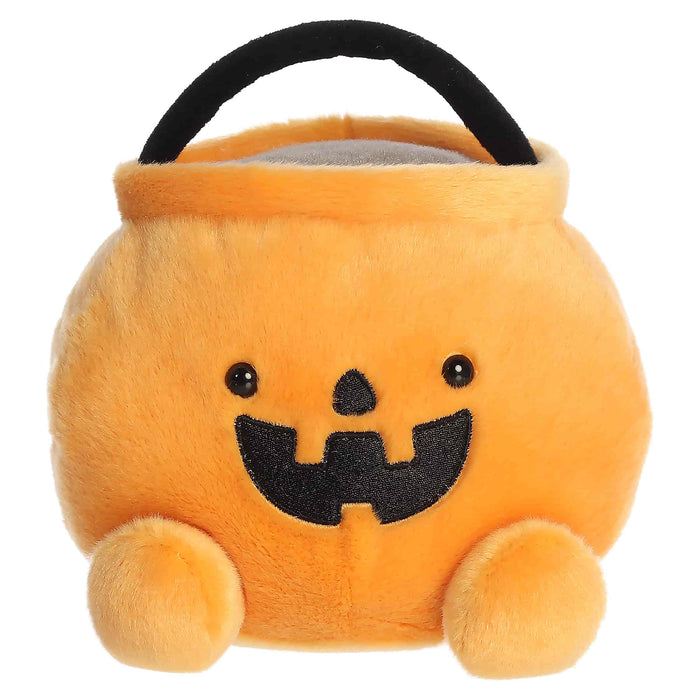 Plush Halloween candy bucket with a smiling face on a white background