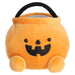 Plush Halloween candy bucket with a smiling face on a white background