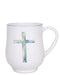 White mug with a blue and green cross design on a white background