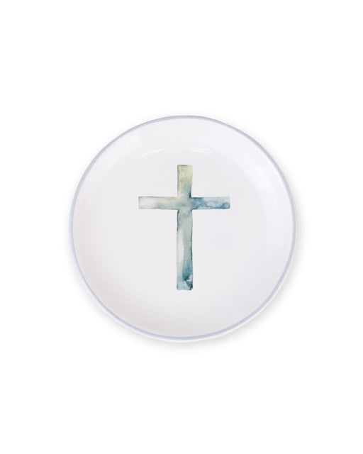 Round white object with a blue cross design on a white background