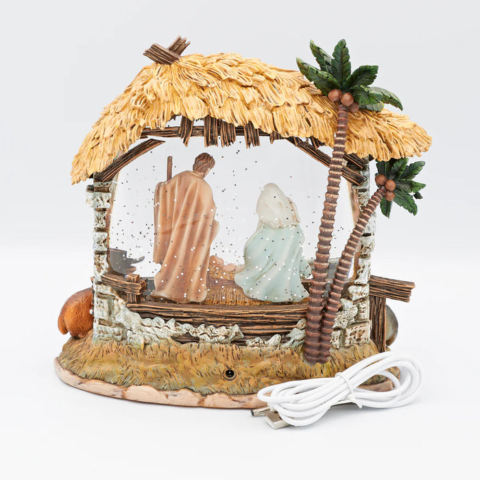 Decorative nativity scene with a thatched roof, USB cable, and figures on a white background