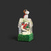 A Snoopy doghouse snow globe figurine featuring Snoopy in a brown aviator hat and red scarf perched atop a clear glass house with a green grass-textured base, set against a dark gray background.