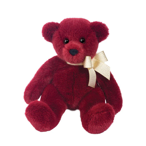 Red teddy bear with a white bow on a white background