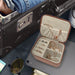 Travel size jewelry box opened with jewelry inside