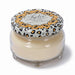 Jar candle with decorative lid on a white background