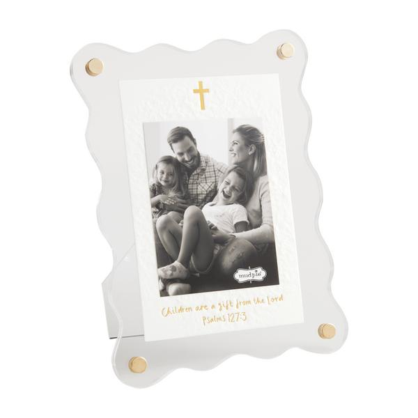 White photo frame with gold accents holding a family photo, on a white background