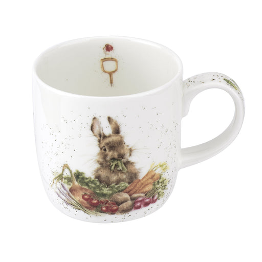 White mug with a rabbit and vegetables design on a white background