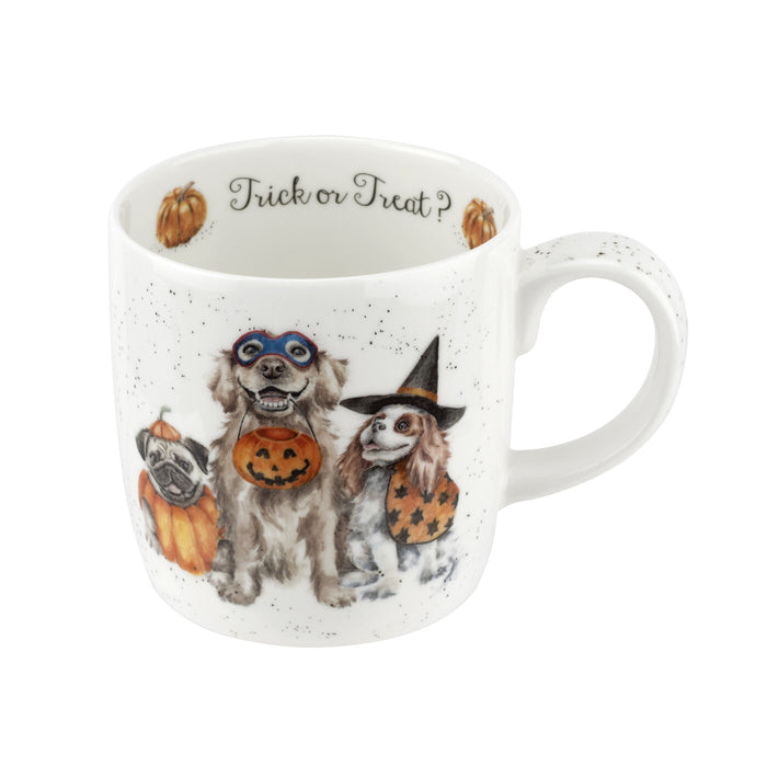 Halloween-themed mug with dogs in costumes and 'Trick or Treat?' text on a white background