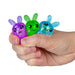 Three colorful finger puppets held in a hand against a white background