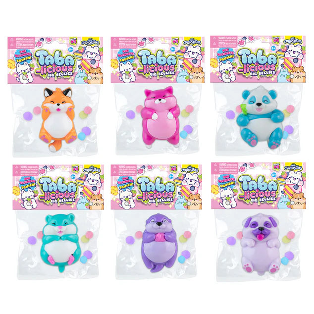Set of six packages of Tabalicious plush toys with colorful packaging on a white background.