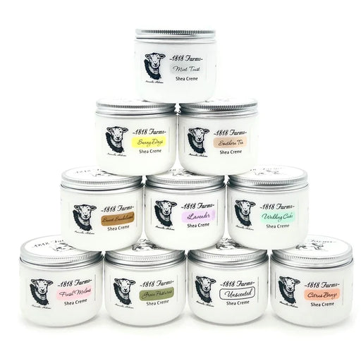 Assorted jars of 1818 Farmer Shea Creme with visible labels on a white background