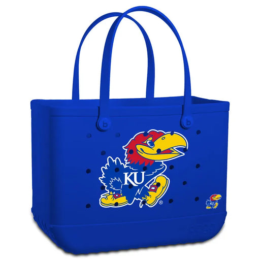 Blue tote bag with a cartoon mascot and 'KU' letters on a white background