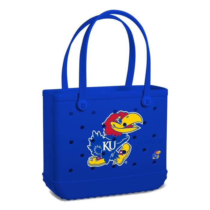 Blue tote bag with a cartoon character and 'KU' logo on a white background