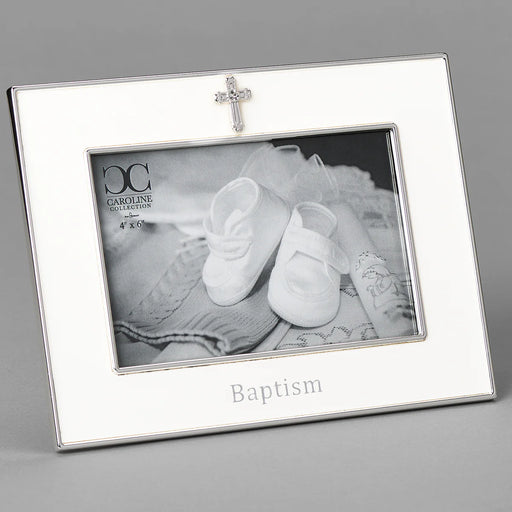 Silver photo frame with 'Baptism' engraving and a cross charm, containing a black and white photo of baby shoes.
