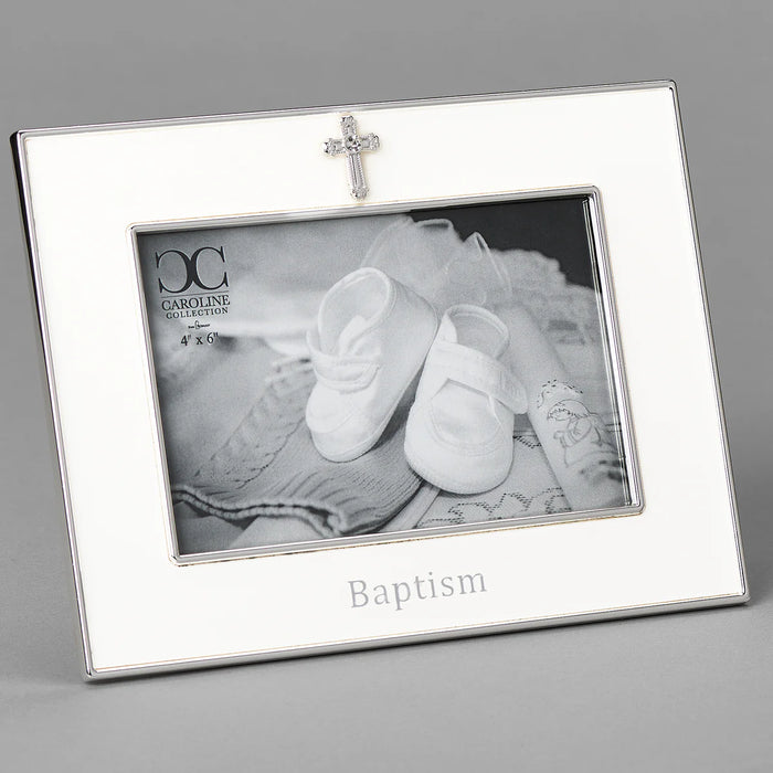 Silver photo frame with 'Baptism' engraving and a cross charm, containing a black and white photo of baby shoes.