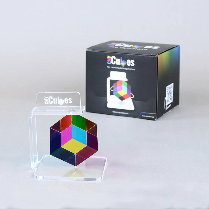Colorful geometric puzzle with packaging on a light gray background