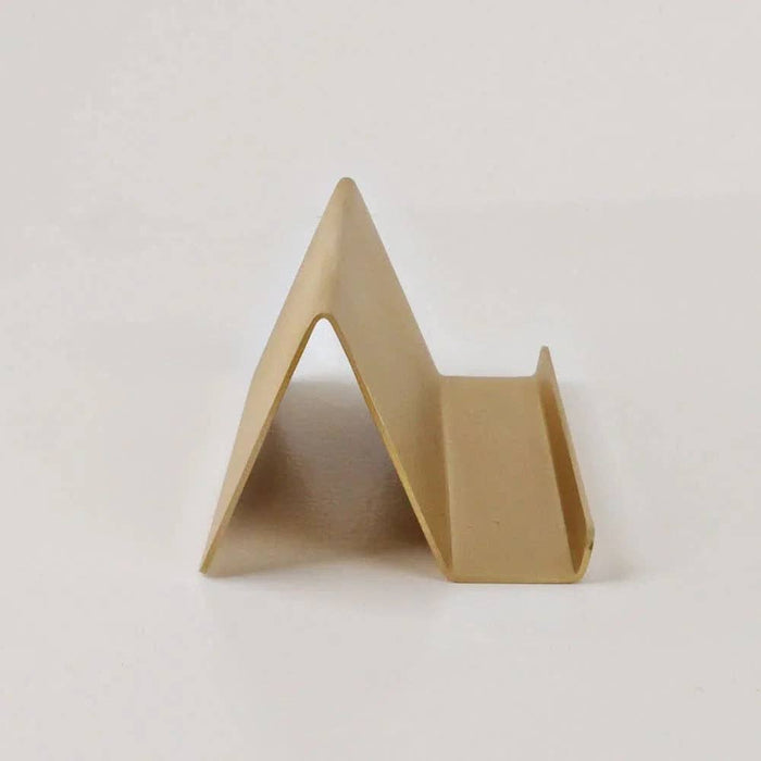 Beige triangular object on a white background