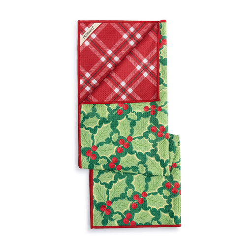 A folded Christmas-themed scarf or bandana featuring a red and white plaid pattern on one half and a green holly and berry pattern on the other, with a small white tag visible.