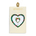 Heart-shaped art pin with 'holly jolly' design on a branded card.