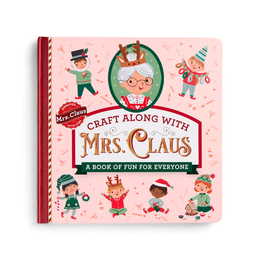 A children's craft book titled 'Craft Along with Mrs. Claus' on a light pink cover with holiday illustrations of children and Mrs.