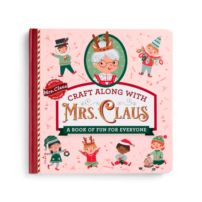 A children's craft book titled 'Craft Along with Mrs. Claus' on a light pink cover with holiday illustrations of children and Mrs.