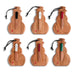 Six wooden Christmas ornament shapes arranged in two rows on a white background, each with a small knife hanging from a black cord and engraved with holiday phrases and a small red heart.
