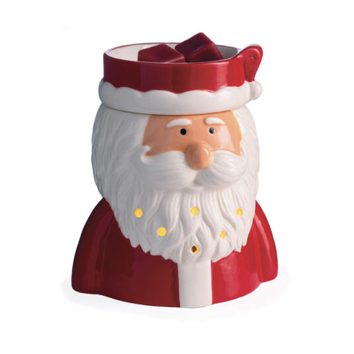 A Santa Claus-themed candle warmer with a red hat, white beard, peach face, and small yellow light accents, shown on a plain white background.