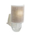 Wall-mounted light fixture with a textured beige shade on a white background
