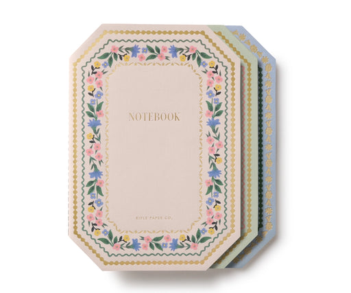 Set of notebooks with floral designs on a white background