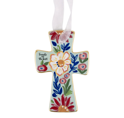 Decorative cross ornament with floral patterns and text on a white background