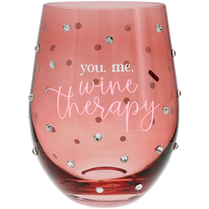 Pink wine glass with 'you. me. wine therapy' text and rhinestone embellishments on a white background