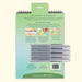 Product packaging with stationery items on a white background